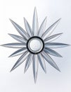 Modern Metallic Sunburst Wall Decor on White Royalty Free Stock Photo
