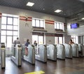 Modern metallic turnstile gate, entrance of railway station. Moscow, Russia