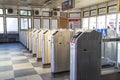 Modern metallic turnstile gate, entrance of railway station. Moscow, Russia