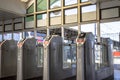 Modern metallic turnstile gate, entrance of railway station. Moscow, Russia