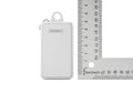 Modern metallic usb flash drive placed next to a measuring ruler showing dimensions and scale Royalty Free Stock Photo