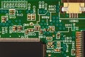 Modern microelectronic circuit board with components closeup.