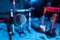 Modern microphone at recording studio, color toned. Music band practice Royalty Free Stock Photo