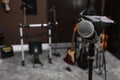 Modern microphone at recording studio, space for text. Music band practice Royalty Free Stock Photo