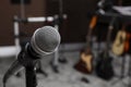 Modern microphone at recording studio, space for text. Music band practice Royalty Free Stock Photo