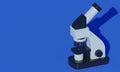 Modern microscope on blue background. 3d rendering