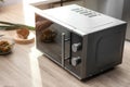 Modern microwave oven on table Royalty Free Stock Photo