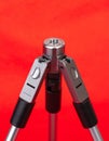 Modern Mini Tripod on a Vibrant Red Background Royalty Free Stock Photo