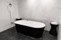 Modern minimalism style bathroom interior in black and white tones Royalty Free Stock Photo