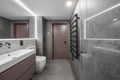 Modern minimalist bathroom interior design with grey stone tiles. Royalty Free Stock Photo