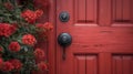 A modern and minimalist black door handle contrasting against a bold bright red door giving personality to a front porch