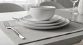 Modern Minimalist Dining Table Setting with White Dinnerware Royalty Free Stock Photo