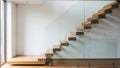 Modern minimalist floating staircase with glass railing in contemporary interior Royalty Free Stock Photo