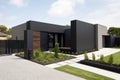 modern, minimalist house exterior with minimalist garden and sleek black fence