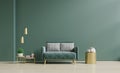 Modern minimalist interior with a green sofa on empty dark green wall Royalty Free Stock Photo