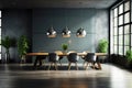 Modern minimalist interior of an office meeting room featuring hanging pendant lights above the tabl