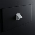 A modern, minimalist light switch on a dark wall features a simple white triangular Royalty Free Stock Photo