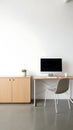 Modern Minimalist Office Workspace with Computer and Storage Cabinet Royalty Free Stock Photo
