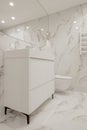 Modern minimalist white bathroom interior design with marble style tiles Royalty Free Stock Photo