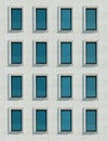Modern minimalistic facade of the building. Windows on light tiles