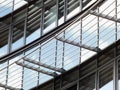 Modern mirrored glass building with curved windows