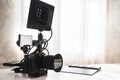 Modern black mirrorless camera rig and clapperboard