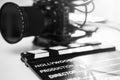 Modern black mirrorless camera rig and clapperboard