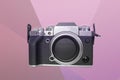 Modern mirrorless digital camera in retro style close-up, black, metal, body without a lens on a colored geometric background, the