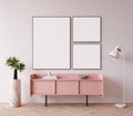 Modern mock up interior with pink commode and empty white picture frames