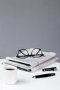 coffee newspaper break business background with pen and glasses financial