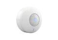 Modern motion sensor device with glowing blue indicator light for smart home security and automation Royalty Free Stock Photo