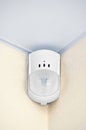 Modern motion sensor on wall Royalty Free Stock Photo