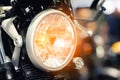 Modern motorcycle headlight woth bokeh in night city street. Royalty Free Stock Photo