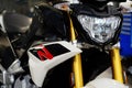 Modern motorcycle headlights. Modern luxury motorcycle. Selective focus Royalty Free Stock Photo