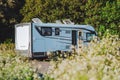 Modern motorhome camper van camping car parked in the nature in free parking and off grid vanlife lifestyle concept. Travel and Royalty Free Stock Photo