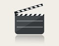 Modern movie clapper icon with reflection on ground Royalty Free Stock Photo