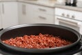 Modern multi cooker with boiled brown rice in kitchen, closeup Royalty Free Stock Photo