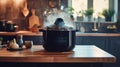 Modern multi cooker and empty plates on table in kitchen