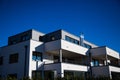 Modern multi family house in munich, blue sky