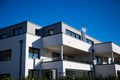 Modern multi family house in munich, blue sky