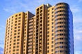 Modern multi-storey building with a glass facade. The evening sunset sky is reflected in the Windows of the facade Royalty Free Stock Photo