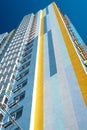 Modern multi-storey residential building. Exterior wall of multicolored high-rise house. View from below Royalty Free Stock Photo