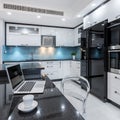 Stylish kitchen interior in white and black Royalty Free Stock Photo