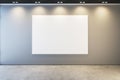 Modern museum or exhibition hall interior with illuminated empty white mock up banner on concrete wall. Royalty Free Stock Photo