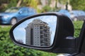 Modern new apartment building in Israel reflected in the side mirror of the car. Real Estate in Israel: buying, selling, renting Royalty Free Stock Photo