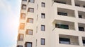 Exterior of a modern multi-story apartment building - facade, windows and balconies. Royalty Free Stock Photo