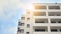 Exterior of a modern multi-story apartment building - facade, windows and balconies. Royalty Free Stock Photo