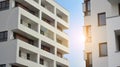 Exterior of a modern multi-story apartment building - facade, windows and balconies. Royalty Free Stock Photo