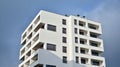 Exterior of a modern multi-story apartment building - facade, windows and balconies. Royalty Free Stock Photo