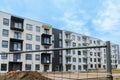 Modern and new apartment building. Multistoried modern, new and stylish living block of flats. construction site in the summer Royalty Free Stock Photo